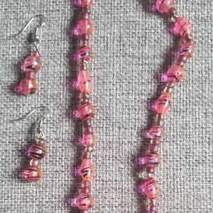 Pink Necklace& Matching earrings.    Hot Pink glass beads with small blue swirls
